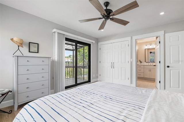 bedroom featuring light wood-style floors, ceiling fan, ensuite bath, access to outside, and baseboards