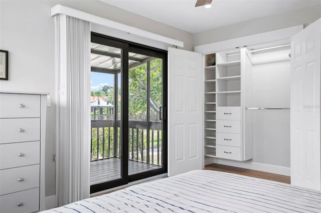 unfurnished bedroom featuring dark hardwood / wood-style floors and access to outside