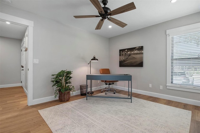 office area featuring recessed lighting, a healthy amount of sunlight, baseboards, and wood finished floors