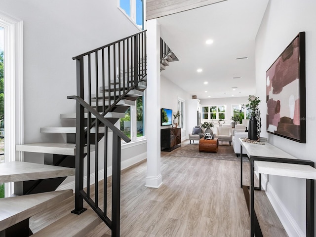 stairway featuring wood-type flooring