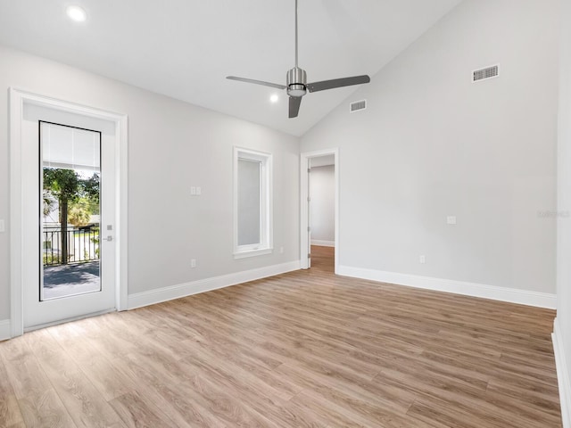 unfurnished room with light hardwood / wood-style flooring, high vaulted ceiling, and ceiling fan