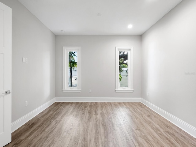 unfurnished room featuring light hardwood / wood-style flooring