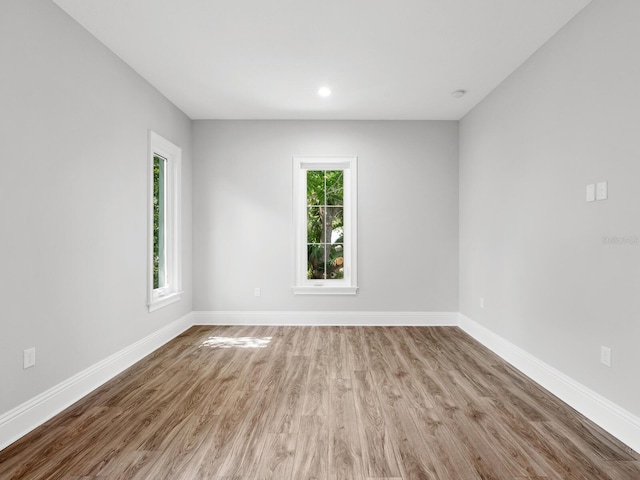 unfurnished room featuring light hardwood / wood-style floors