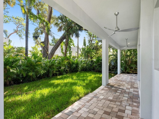 view of yard with ceiling fan