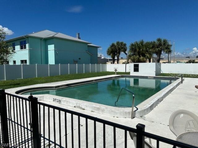 community pool featuring fence