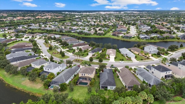 aerial view with a residential view and a water view