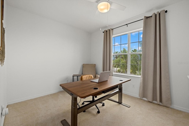 office featuring baseboards and light colored carpet