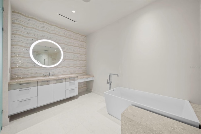 bathroom with vanity and a bathtub