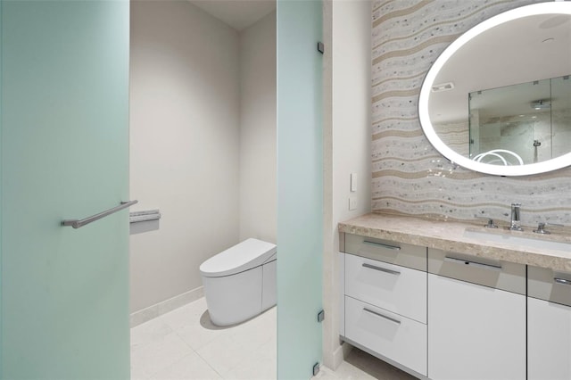 bathroom with tile patterned floors, vanity, and toilet