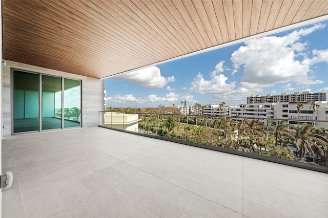 view of patio featuring a balcony