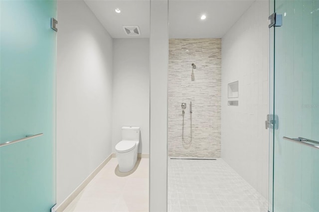 bathroom with tile patterned floors, toilet, and an enclosed shower