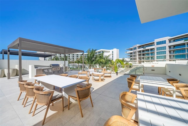 view of patio / terrace featuring grilling area and a balcony