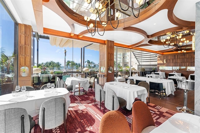 dining room with a notable chandelier and wood-type flooring