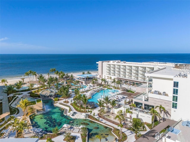 birds eye view of property with a view of the beach and a water view