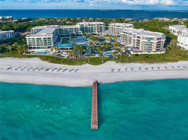 bird's eye view with a beach view and a water view