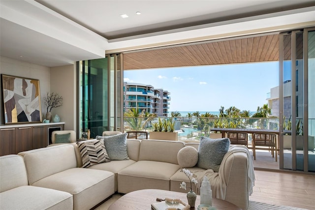 1591 Gulf Of Mexico Dr Unit 311, Longboat Key, FL 34228 - living room featuring wood finished floors