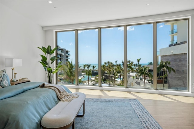 1591 Gulf Of Mexico Dr Unit 311, Longboat Key, FL 34228 - bedroom featuring wood finished floors