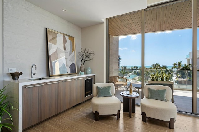 1591 Gulf Of Mexico Dr Unit 311, Longboat Key, FL 34228 - living area featuring expansive windows and wood finished floors