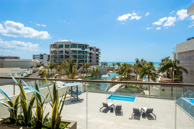 1591 Gulf Of Mexico Dr Unit 311, Longboat Key, FL 34228 - view of swimming pool featuring a water view