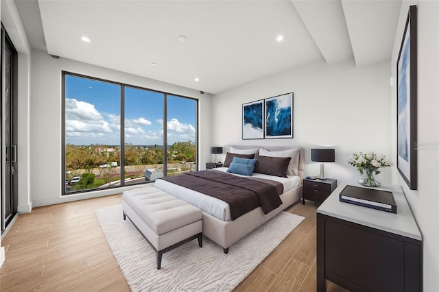 bedroom with light hardwood / wood-style floors