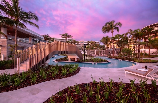 view of pool at dusk