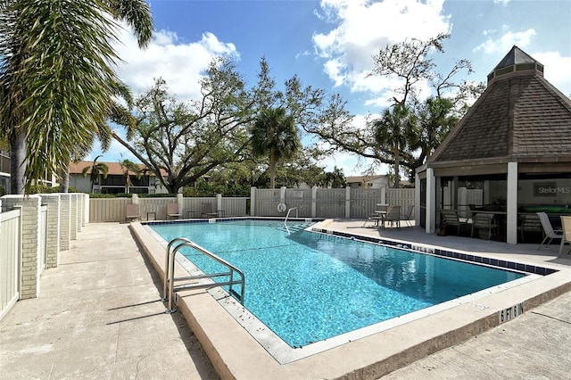 view of pool featuring a patio and a gazebo