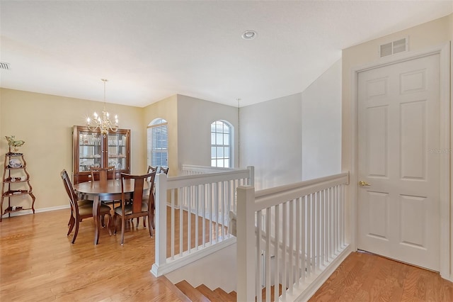 4517 Streamside Ct Unit 1905, Sarasota, FL 34238 - dining space featuring light wood-style flooring, a chandelier, baseboards, and recessed lighting