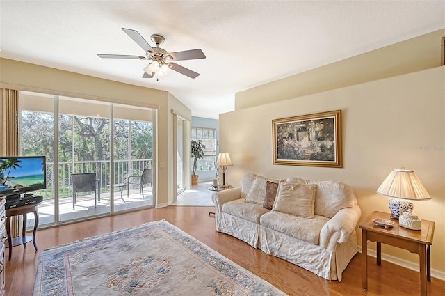 4517 Streamside Ct Unit 1905, Sarasota, FL 34238 - living room featuring a ceiling fan, baseboards, and wood finished floors
