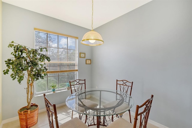 dining space with light tile patterned floors