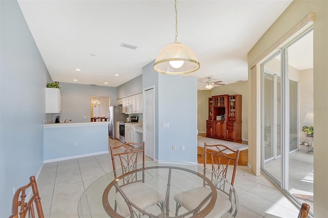 tiled dining room with ceiling fan