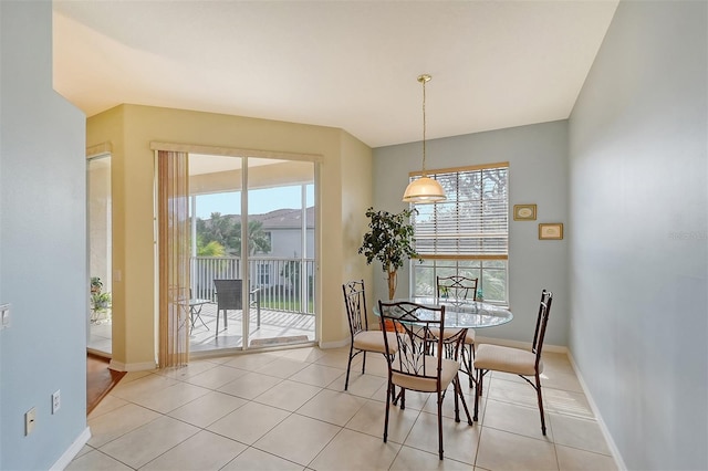 dining space with light tile patterned flooring