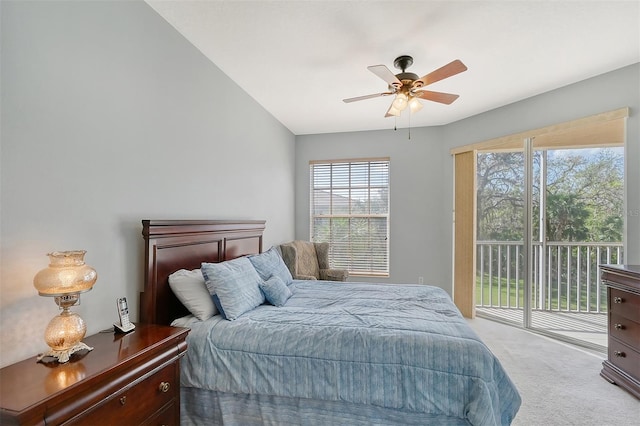 carpeted bedroom featuring ceiling fan, vaulted ceiling, and access to outside