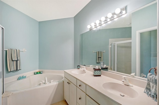 bathroom with vanity and separate shower and tub