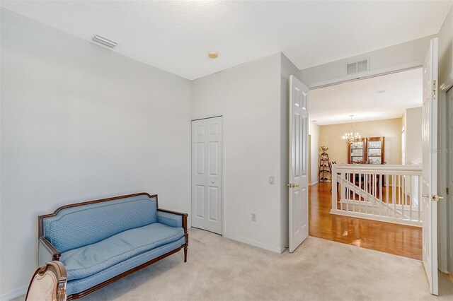 4517 Streamside Ct Unit 1905, Sarasota, FL 34238 - living area with a chandelier, light carpet, and baseboards
