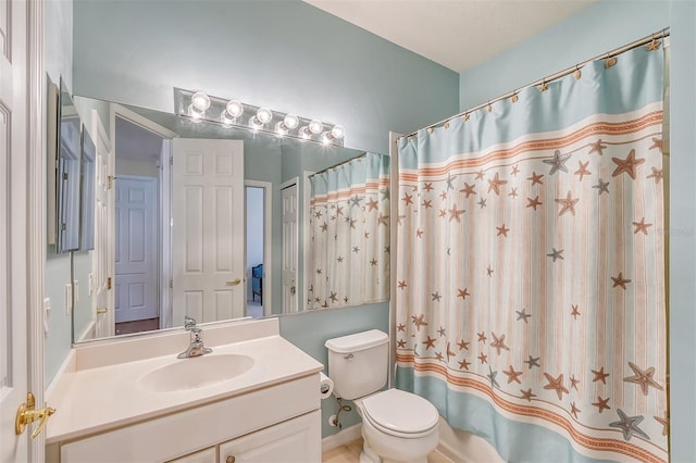 bathroom featuring toilet, a shower with curtain, and vanity