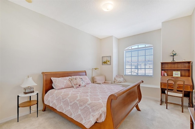 bedroom featuring light colored carpet