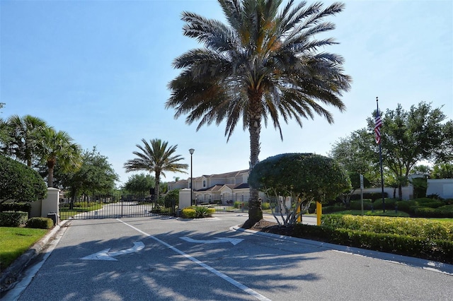 4517 Streamside Ct Unit 1905, Sarasota, FL 34238 - view of asphalt street featuring curbs, a gate, street lighting, and a gated entry