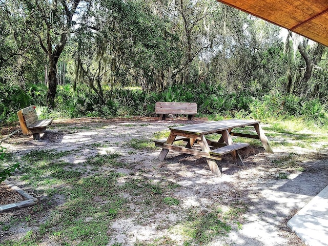 4517 Streamside Ct Unit 1905, Sarasota, FL 34238 - view of yard with outdoor dining area and a view of trees