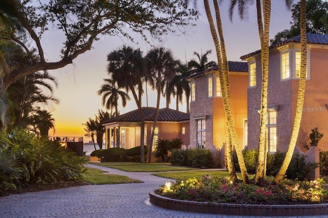 4511 Bay Shore Rd, Sarasota, FL 34234 - view of front facade featuring a tile roof and stucco siding