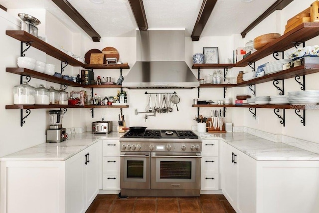 4511 Bay Shore Rd, Sarasota, FL 34234 - kitchen with open shelves, double oven range, wall chimney exhaust hood, beamed ceiling, and light stone countertops