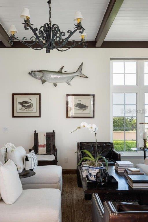 4511 Bay Shore Rd, Sarasota, FL 34234 - living room with a chandelier, plenty of natural light, and beam ceiling