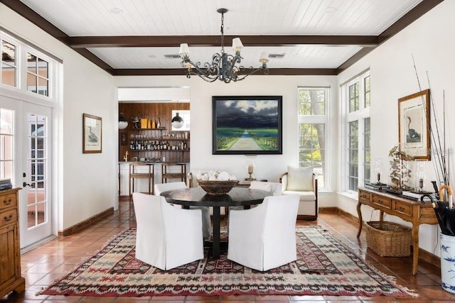 4511 Bay Shore Rd, Sarasota, FL 34234 - tiled dining area with a chandelier, baseboards, and wooden ceiling with exposed beams