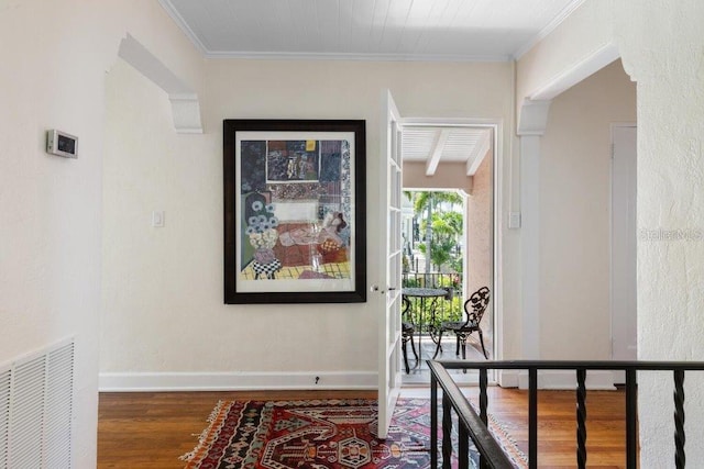 4511 Bay Shore Rd, Sarasota, FL 34234 - hallway featuring wood finished floors, crown molding, and baseboards