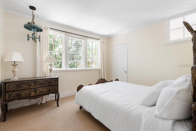 4511 Bay Shore Rd, Sarasota, FL 34234 - carpeted bedroom with ornamental molding and baseboards