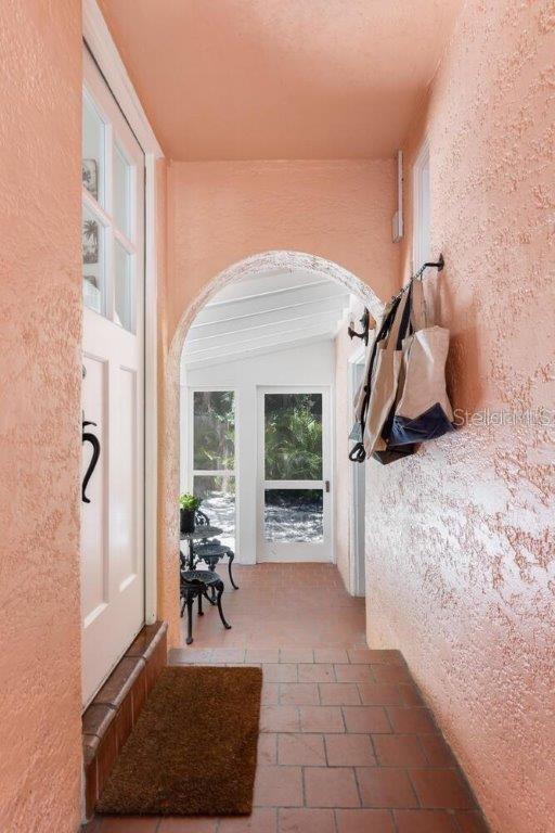 4511 Bay Shore Rd, Sarasota, FL 34234 - hallway with arched walkways
