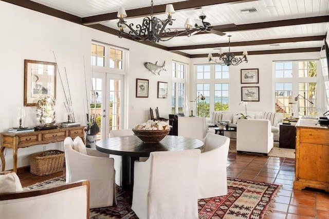 dining area with a notable chandelier, wood ceiling, a wealth of natural light, and beamed ceiling