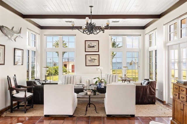 interior space featuring wood ceiling, dark tile patterned flooring, and beam ceiling