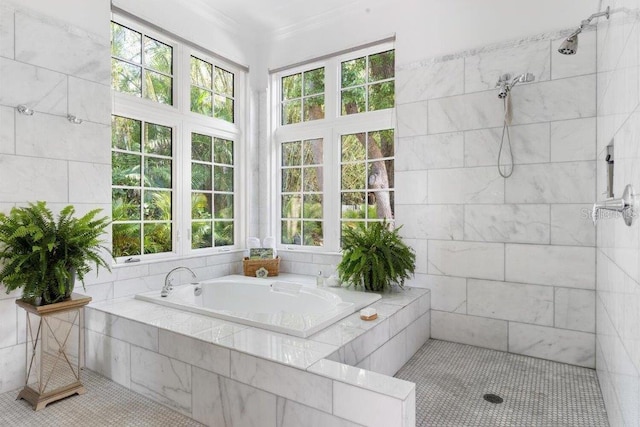 bathroom with a healthy amount of sunlight, ornamental molding, and shower with separate bathtub