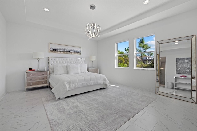 bedroom with a notable chandelier