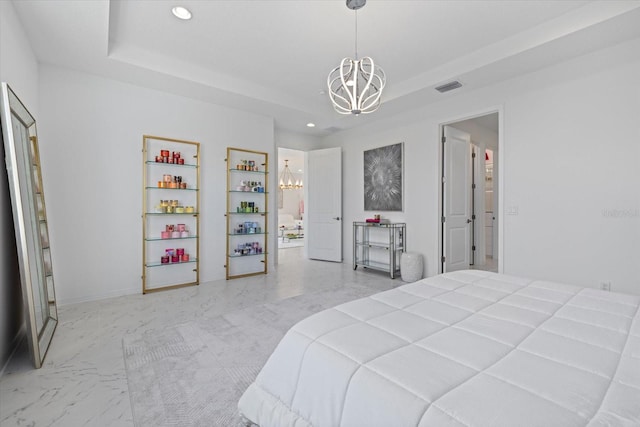 bedroom featuring an inviting chandelier